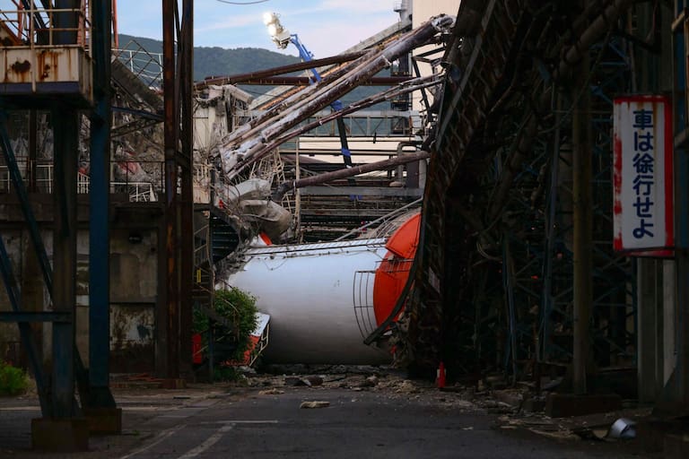 TOPSHOT - A collapsed chimney is seen at Nippon Paper Industries' Yatsushiro Mill in Yatsushiro, Kumamoto prefecture on July 29, 2026, after an earthquake struck southwestern Japan the previous day. (Photo by Yuichi YAMAZAKI / AFP)