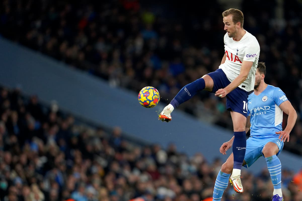 Tottenham's Harry Kane kicks the ball during the English Premier League soccer match between Manchester City and Tottenham Hotspur, at the Etihad stadium in Manchester, England, Saturday, Feb. 19, 2022. (AP Photo/Jon Super)
