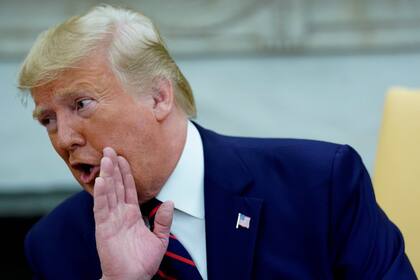 Trump, ayer, en una reunión en el Salón Oval