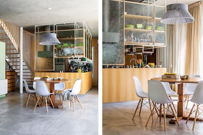 Ubicado en el medio del gran ambiente de la planta baja, el comedor enfatiza su centralidad. Mesa redonda (Mercado de Pulgas). Sillas DSW (desillas.com). Lámpara colgante con hilos de lana (Atmósfera Luz).
