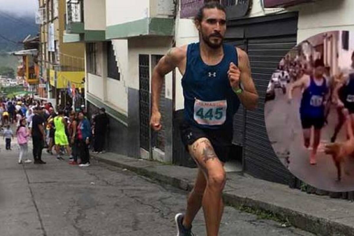 Un atleta colombiano patea a un perro durante una carrera