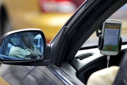 Un conductor del servicio Didi, la aplicación de transporte con conductores particulares que cuenta con el apoyo de Tencent y Alibaba