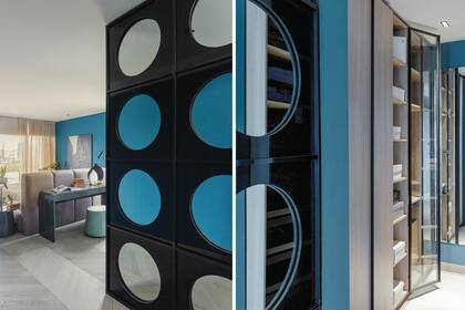 Un panel de espejos circulares (Concepto Design Center) acompaña el tránsito entre el vestidor y el espacio central de la suite.