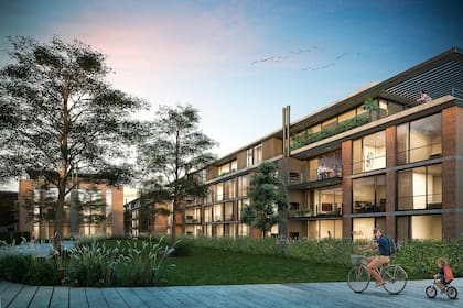 Una gran estructura metálica adosada a la construcción original permite desarrollar generosos balcones-terraza con parrilla que enfatizan la estética industrial y alivianan la fachada de ladrillos.