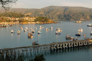 Una vista típica de Concepción, con su caudaloso Río Biobío y su antiguo muelle