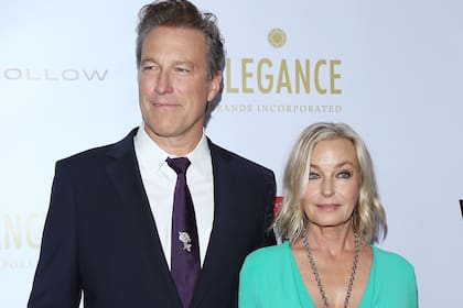 US actress Bo Derek (C), husband actor John Corbett (L) and US/Beninese actor Djimon Hounsou (R) arrive for the 2019 WildAid Gala "A Night in Africa" at the Beverly Wilshire Four Seasons hotel in Beverly Hills on November 9, 2019. - WildAid is a global conservation organization leading the