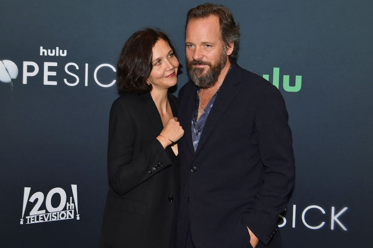 US actress Maggie Gyllenhaal (L) and husband US actor Peter Sarsgaard attend the Hulu premiere of "Dopesick" at the Museum of Modern Art (MoMA) on October 4, 2021 in New York City. (Photo by Angela Weiss / AFP)