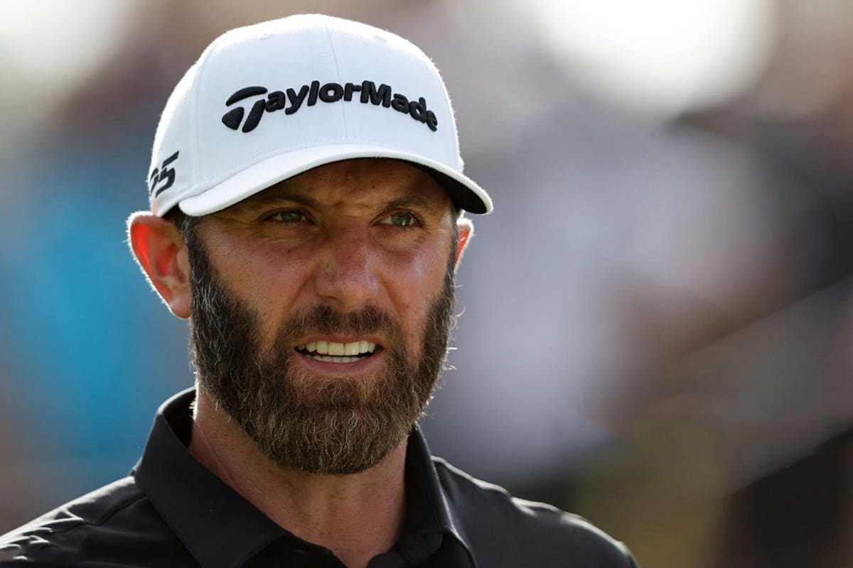 US golfer Dustin Johnson reacts as he prepares to play a shot on the 16th hole on the third and final day of the LIV Golf Invitational Series event at The Centurion Club in St Albans, north of London, on June 11, 2022. - The LIV Golf Invitational London, the launch event of a lucrative and divisive series that is rocking the sport reaches it's conclusion. The $25 million event in St Albans -- the biggest prize pot in history -- is the first of eight tournaments this year bankrolled by Saudi Arabia's sovereign wealth fund, worth a combined $255 million. (Photo by Adrian DENNIS / AFP)