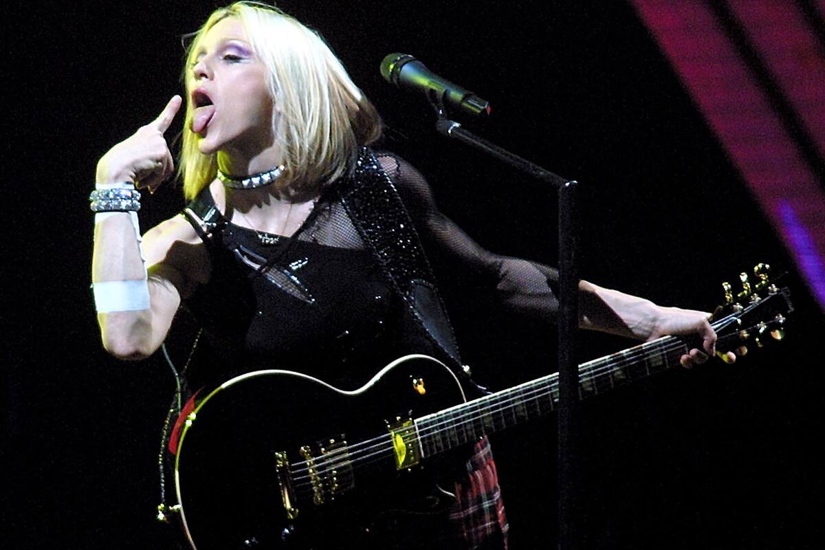U.S. singer Madonna performs in Barcelona, Spain, Saturday, June 9, 2001, during the first concert of her European and World tour. The tour is called the "Drowned World Tour 2001" and will take the singer to London, Paris, Berlin, Milan and New York (AP Photo/Cesar Rangel)