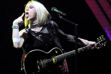 U.S. singer Madonna performs in Barcelona, Spain, Saturday, June 9, 2001, during the first concert of her European and World tour. The tour is called the "Drowned World Tour 2001" and will take the singer to London, Paris, Berlin, Milan and New York (AP Photo/Cesar Rangel)