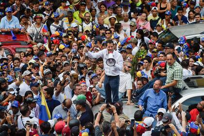 Venezuelan opposition leader and self-proclaimed acting president Juan Guaido speaks during a demo in Caracas on March 9, 2019. - Riot police blocked protesters as thousands of people took to the streets Saturday with tensions rising between opposition leader Juan Guaido and President Nicolas Maduro
