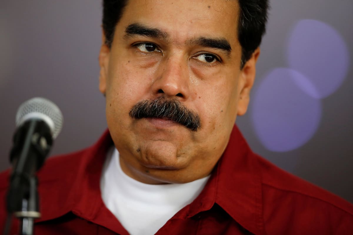 Venezuelas President Nicolas Maduro gestures while he talks to the media during a news conference before his departure to Cuba at the Simon Bolivar airport in La Guaira, Venezuela April 20, 2018