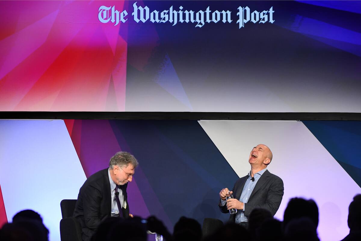 WASHINGTON, DC - MAY 18: Amazon founder and owner of The Washington Post via Getty Images Jeff Bezos (R) is interviewed by Post Editor Martin Baron in Washington, DC on May 18, 2016. It was all part of The Washington Post via Getty Images's Transformers day long event featuring technological advances and business moves that are upending industries and changing lives. (Photo by Linda Davidson / The Washington Post via Getty Images)