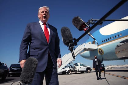 WEST PALM BEACH, FLORIDA - OCTOBER 31: US President Donald Trump speaks to reporters as he arrives at Palm Beach International Airport on October 31, 2025 in West Palm Beach, Florida. Trump is spending the weekend at his Mar-A-Lago estate in Palm Beach, Florida. Samuel Corum/Getty Images/AFP (Photo by Samuel Corum / GETTY IMAGES NORTH AMERICA / Getty Images via AFP)