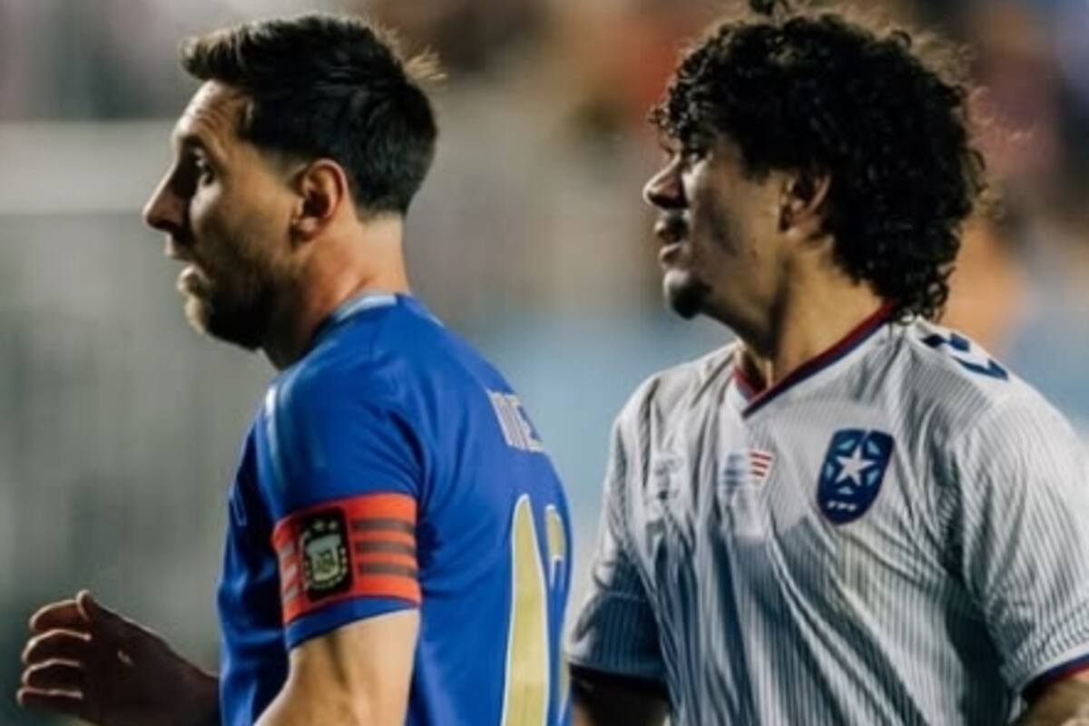 Wilfredo Rivera, en acción junto a Lionel Messi, durante un amistoso entre Argentina y Puerto Rico; el futbolista boricua jugará en Barracas Central