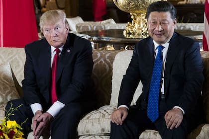 Xi Jinping con Donald Trump, en la residencia de Florida, el año pasado