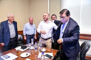 Guzmán y Moroni en su última visita a la CGT, rodeados por Lingeri, Rodríguez y Martínez